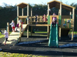 Children enjoy the new play equipment in Cookhill